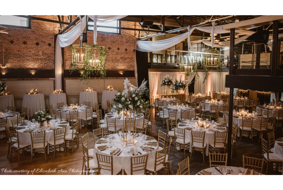 The Rose Event Center set up for a wedding with tables and decorations