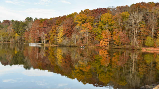 Lake Herrick reflecting the fall colors around it