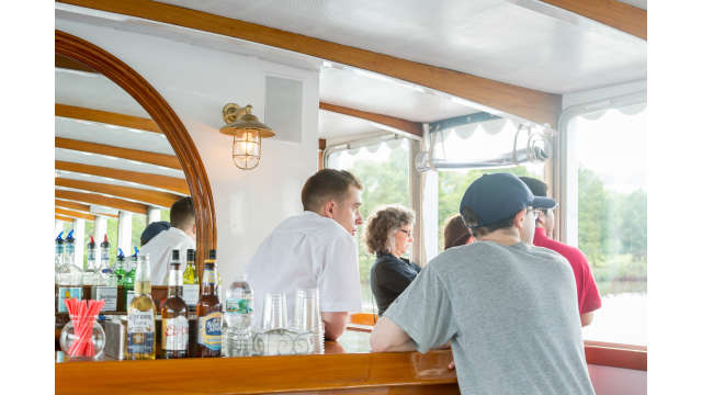 Guests enjoy the bar on the Charles River Cruise