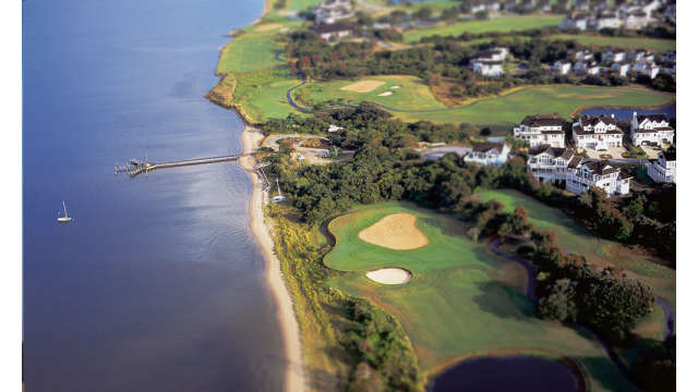 Aerial view of a golf course along the coast in the Outer Banks