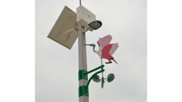 Image of artwork, pink flamingo wind vane