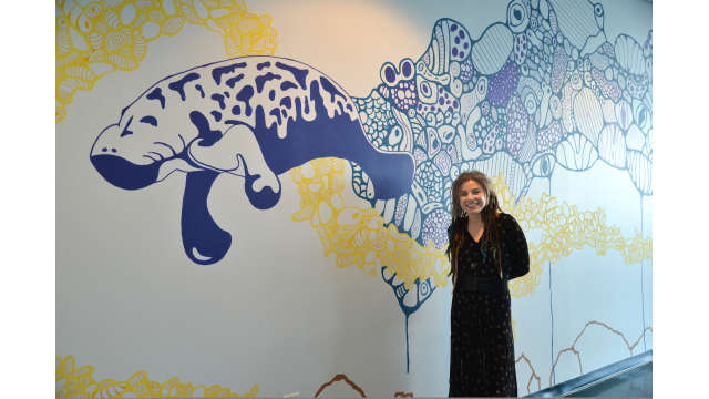 Photo of public artwork, undersea wall mural featuring manatees and turtles
