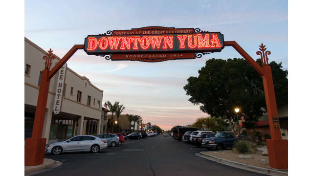 Downtown Yuma sign lit at twilight