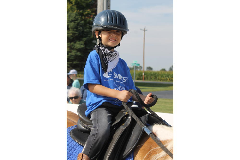 child on horse