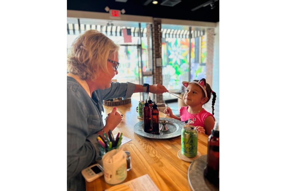 Child pouring candles