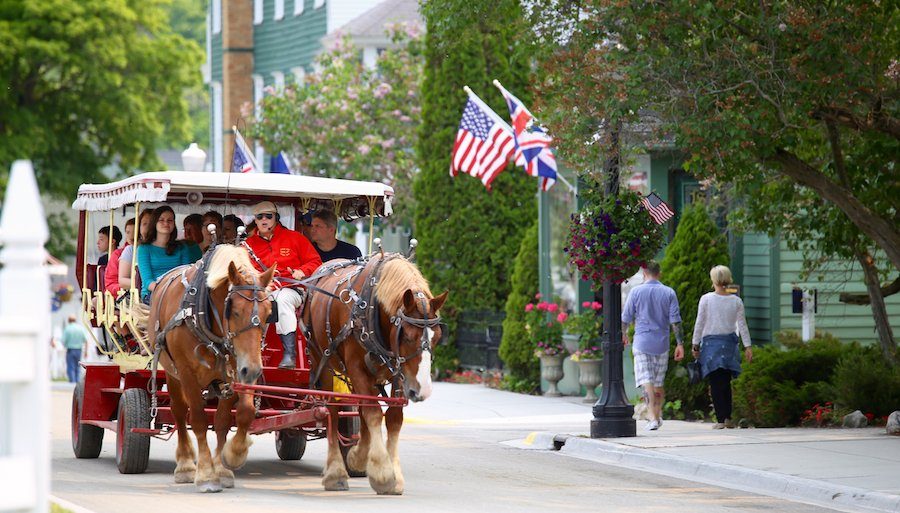 https://assets.simpleviewinc.com/simpleview/image/upload/crm/MackinacIslandMI/Carriage-tour-w_Flags_2eaaf128-42c3-468b-bef9-ca6d0c9251d4.jpg
