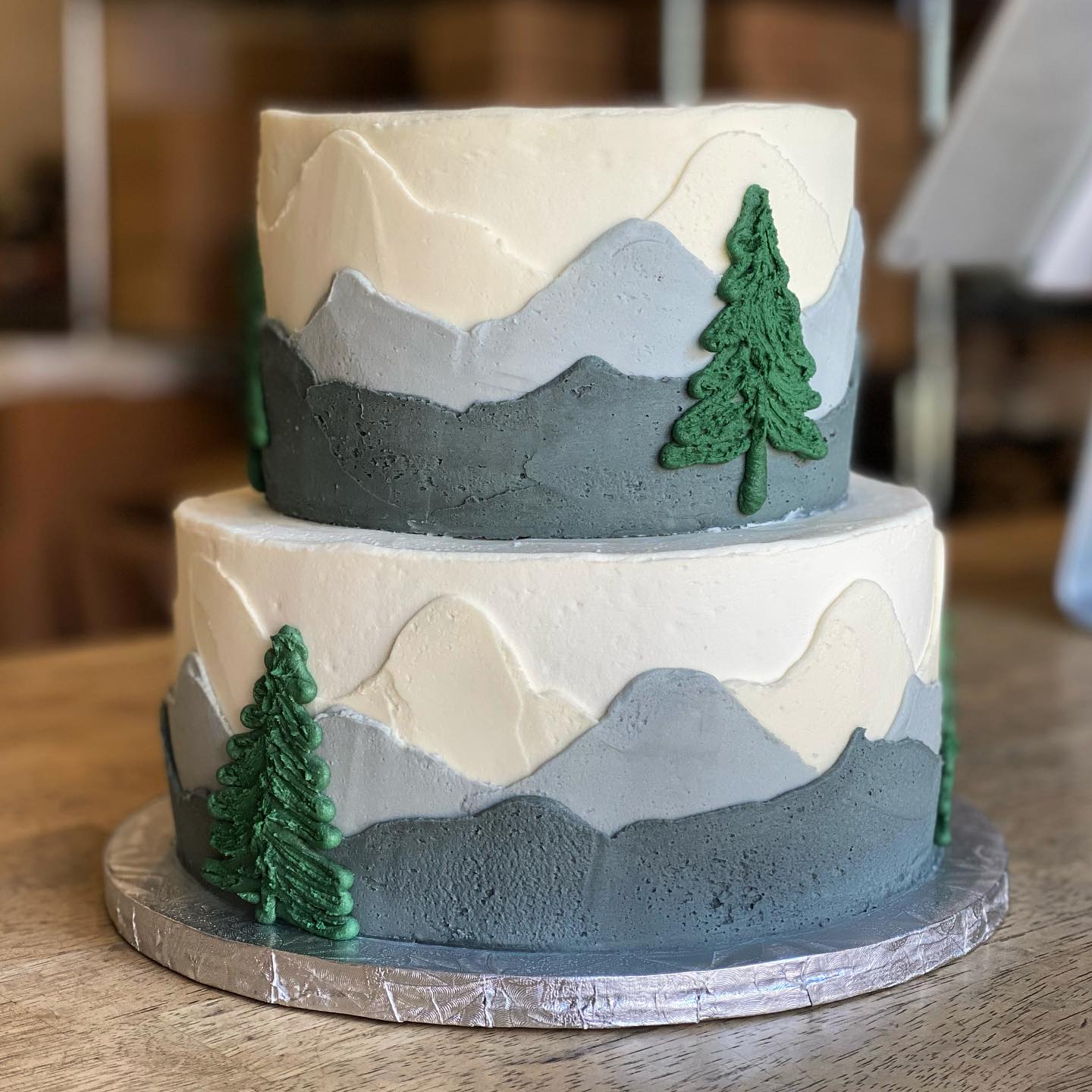 TK's Cakes | Golfing, fishing and hunting cake! I love the transition in  these tiers and how the water theme is in the middle! The painted mountain  co... | Instagram