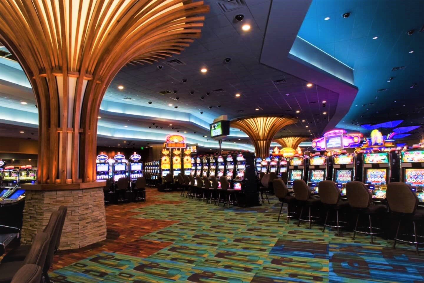 A vibrant casino floor with slot machines and lights, representing the Spirit casino gaming environment.