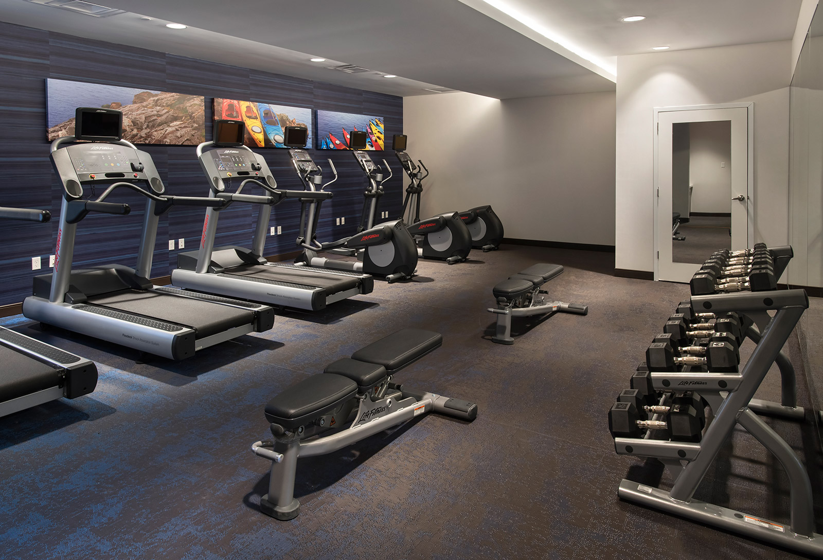 Fitness Center - Maintain your healthy lifestyle while on the road with our cardiovascular equipment and free weights in the exercise center.