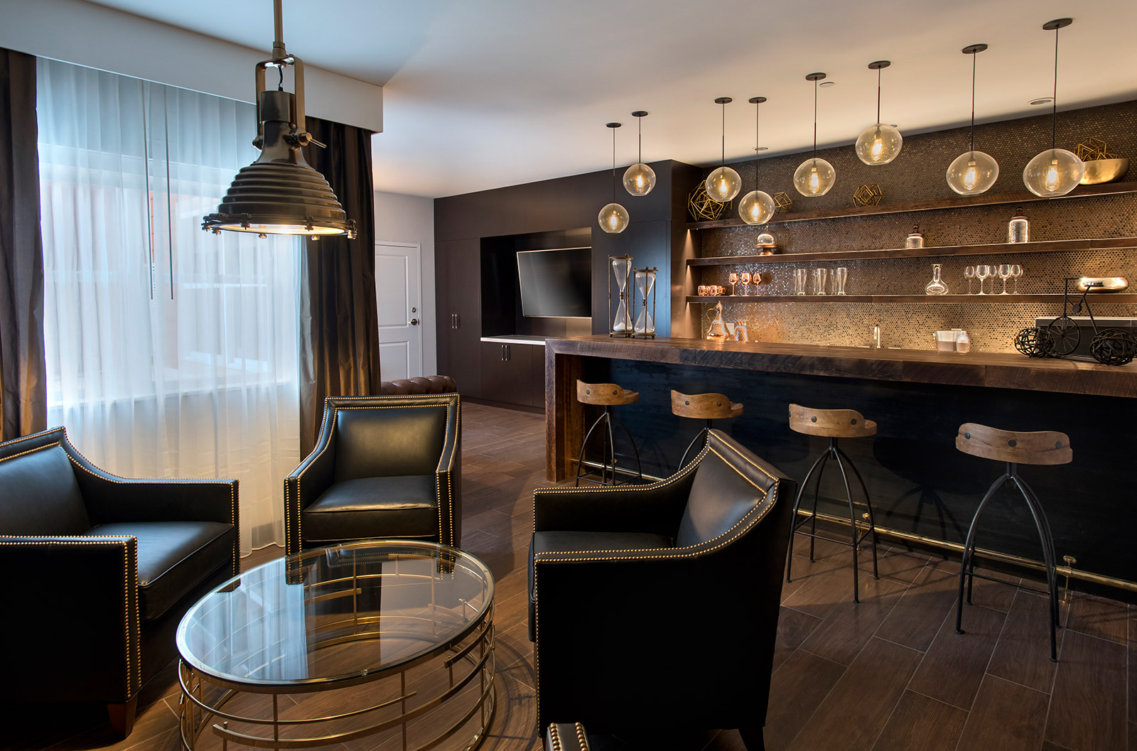 The Den - The Den welcomes you to relax and gather in a perfectly polished space.  This suite has a built-in bar, classic industrial tones, and complimentary high-speed Internet access.