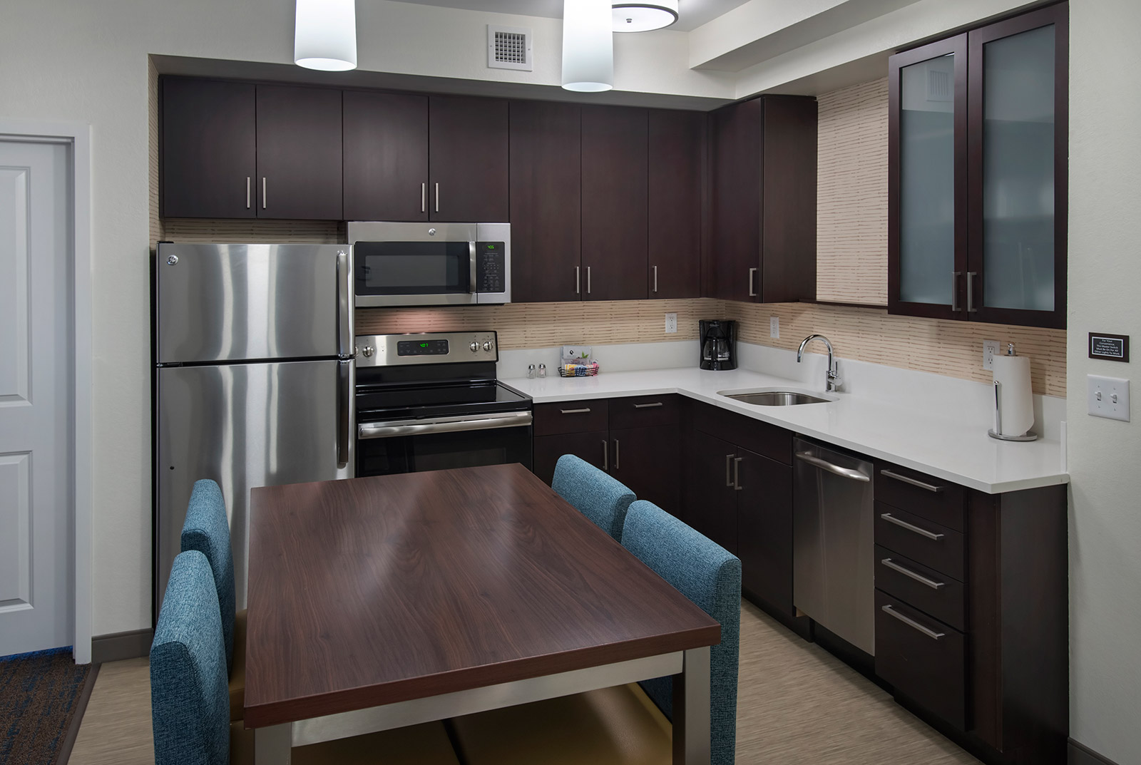 Suite Kitchen - Even when youu2019re far from home, enjoy your favorite home-cooked meals with ease. Our Riverhead, New York hotel suites offer a fully-equipped kitchen with stainless steel appliances, cookware and utensils.