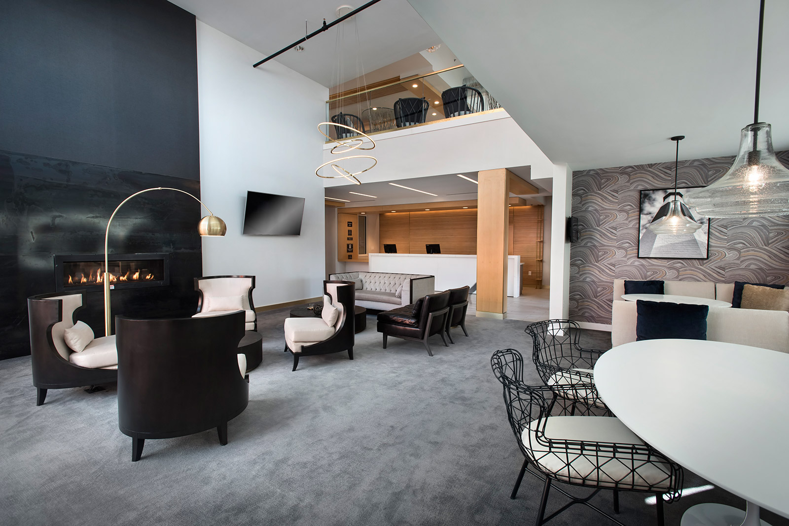 Lobby - During downtime, gather for fireside conversation or quiet reading time in the lobby at our extended-stay hotel in Riverhead, New York.