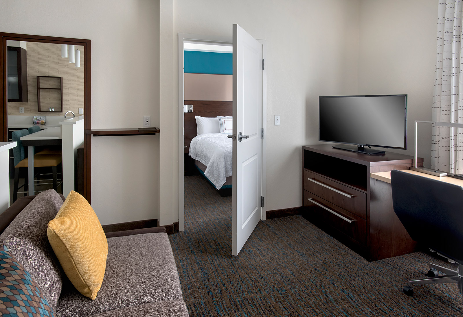 One Bedroom King Suite - Our one bedroom suites feature pull-out sofa beds to host friends and family in separate living areas.