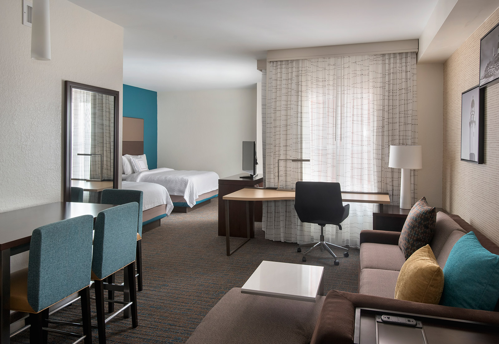 Queen Studio Suite - Catch your favorite shows from the comfort of our spacious suites. Spread out in our plush bedding and browse our premium channel listings for a relaxing night in town.
