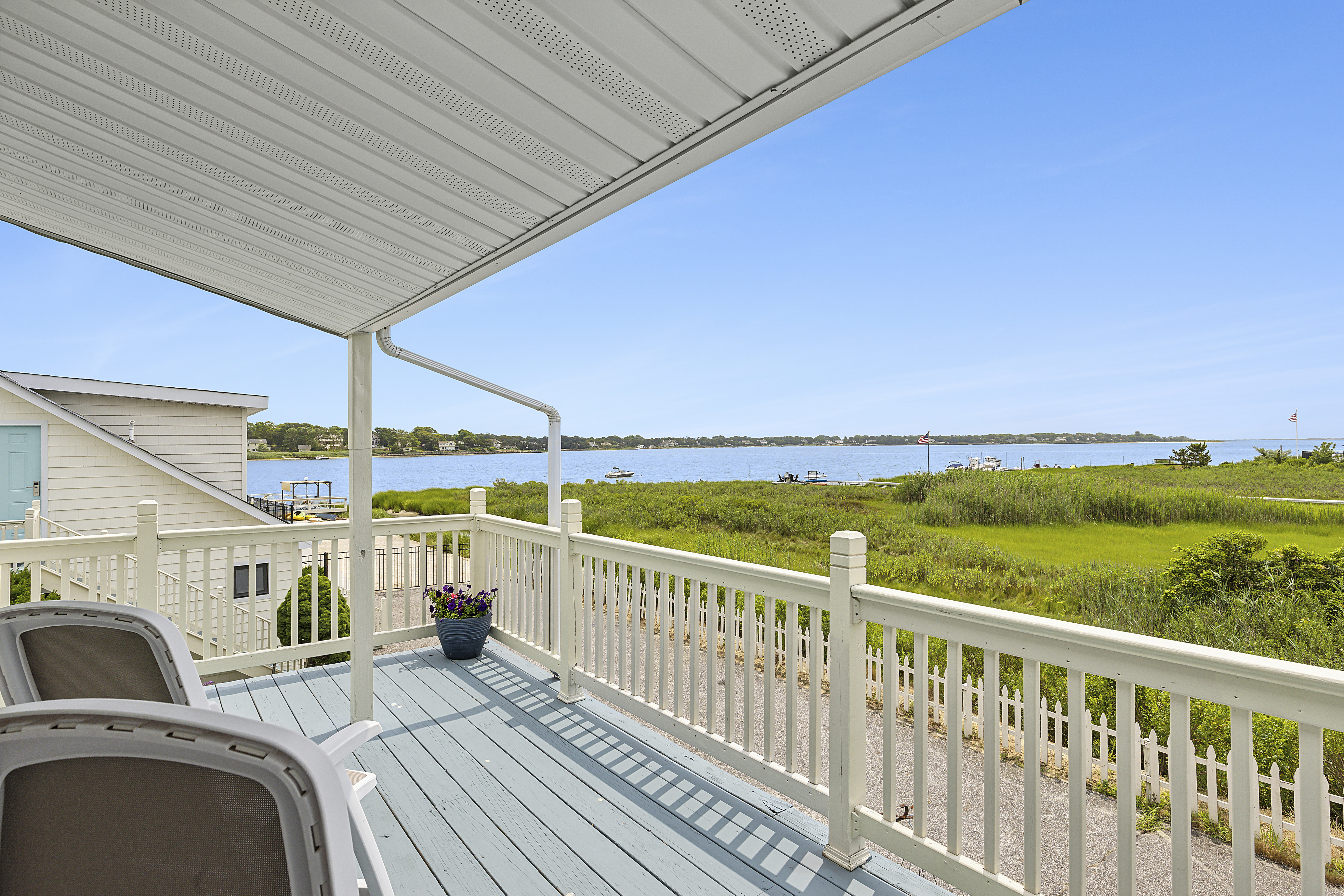 Room Class - Balcony (Queen and Twin) - Pictured is our stunning views of Tiana Bay from the shared balcony for the Balcony Queen and Balcony Twin room classes! Outside each room is fitted with two lounge chairs and a small coffee table.