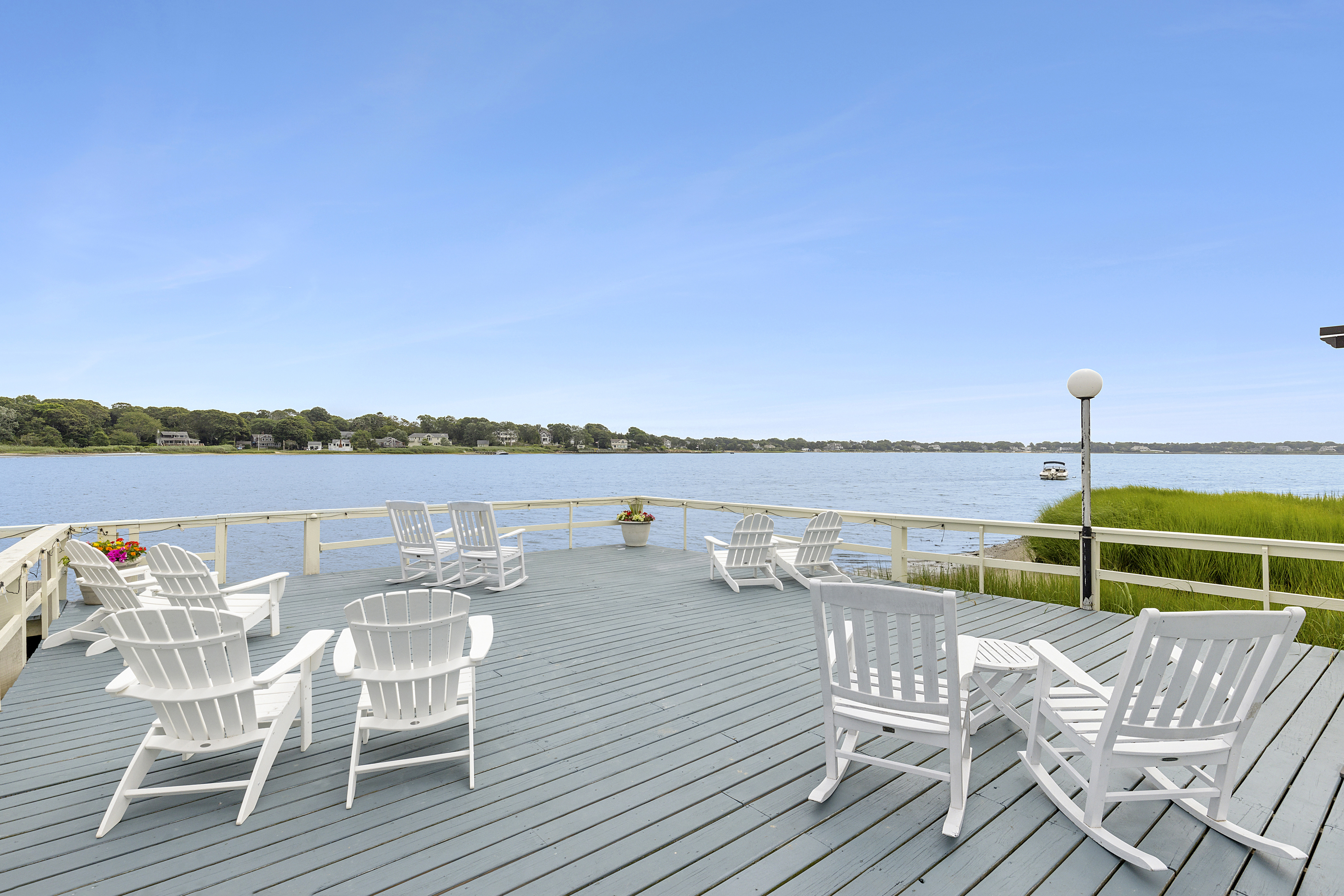 Waterfront Amenities - Dock - Our beautiful dock, which is situated on Tiana Bay, features plenty of comfortable and adjustable seating to either soak in the rays during the day or watch the beautiful evening sunsets!