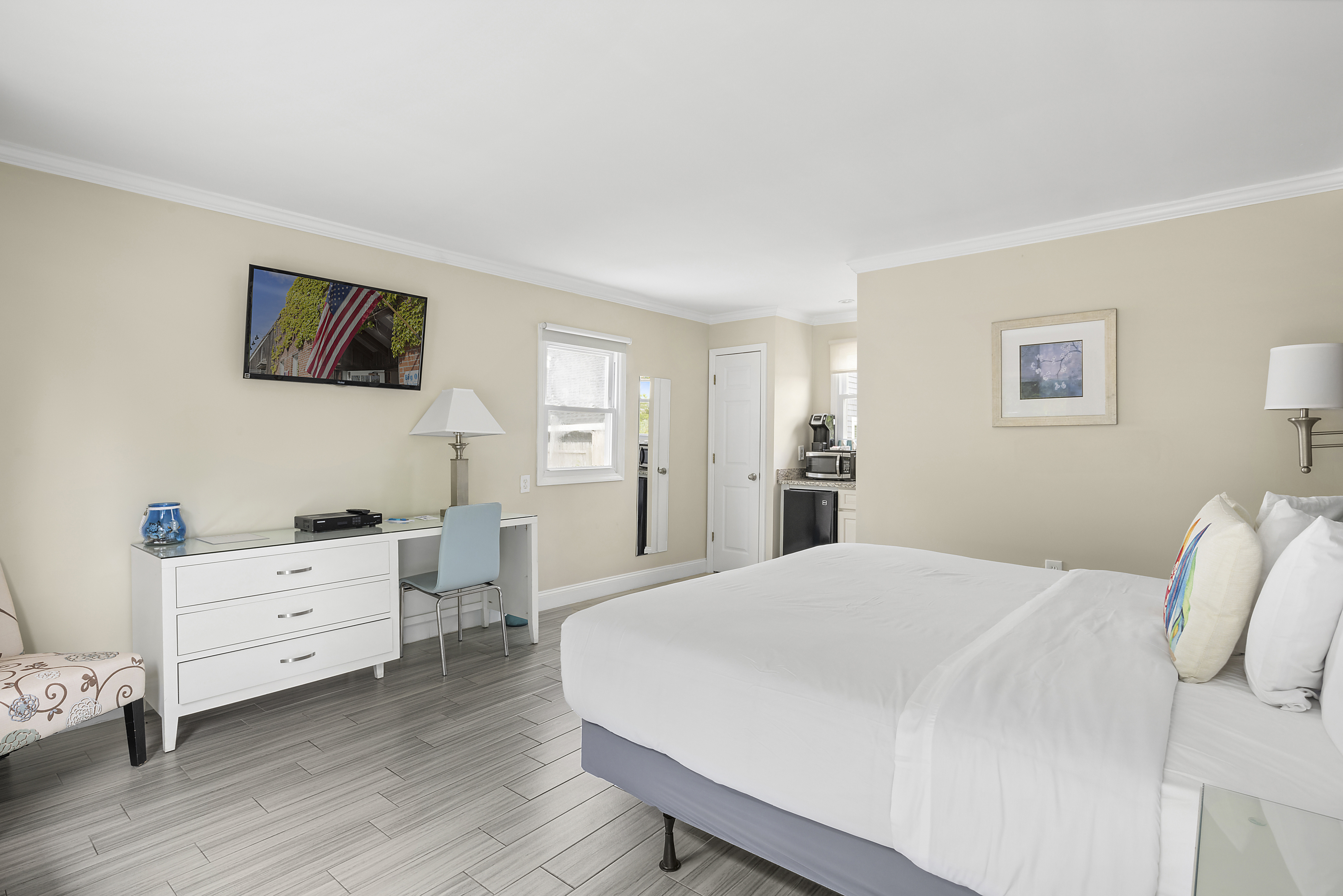 Room Class - Standard King - The Standard King rooms are located on the ground level. Each Standard King room features one (1) king-sized bed, a kitchenette, and a flat-screen TV. There are three (3) Standard King rooms on our premises.
