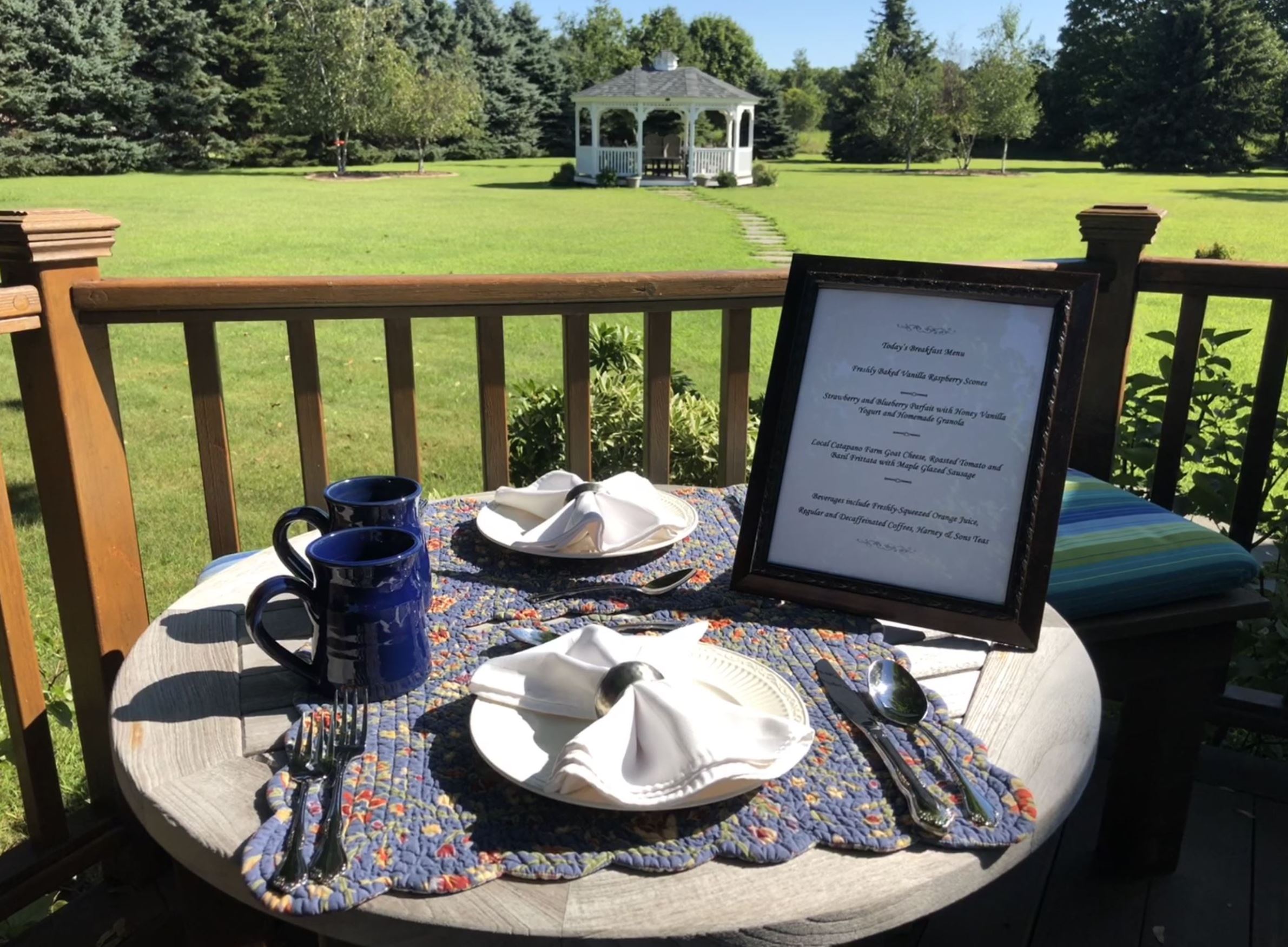 Breakfast is served! - Enjoy your three course gourmet breakfast on our back deck overlooking our beautifully landscaped 2 acre property and gazebo!