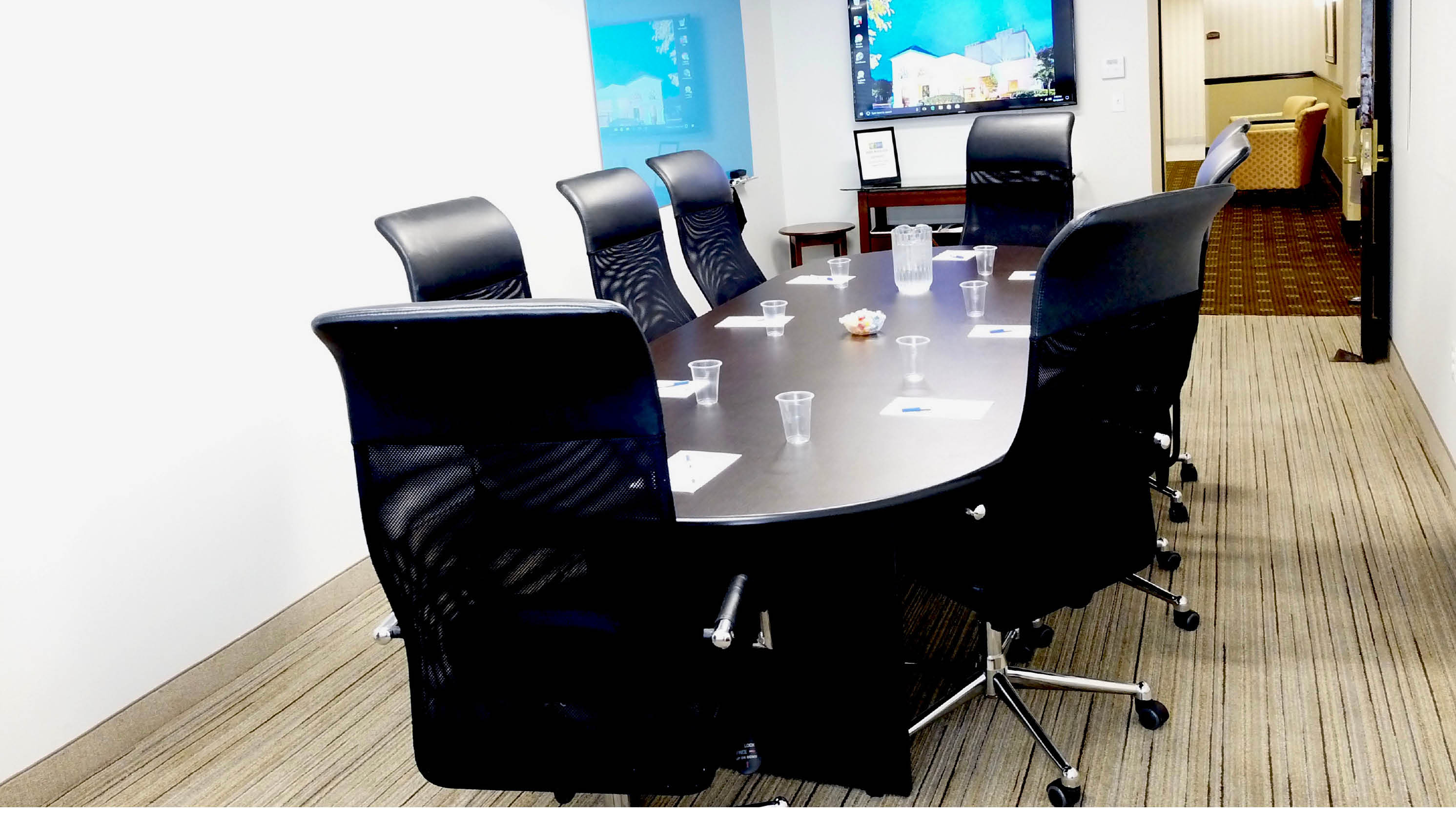 Newly renovated conference room sits up to 8 people