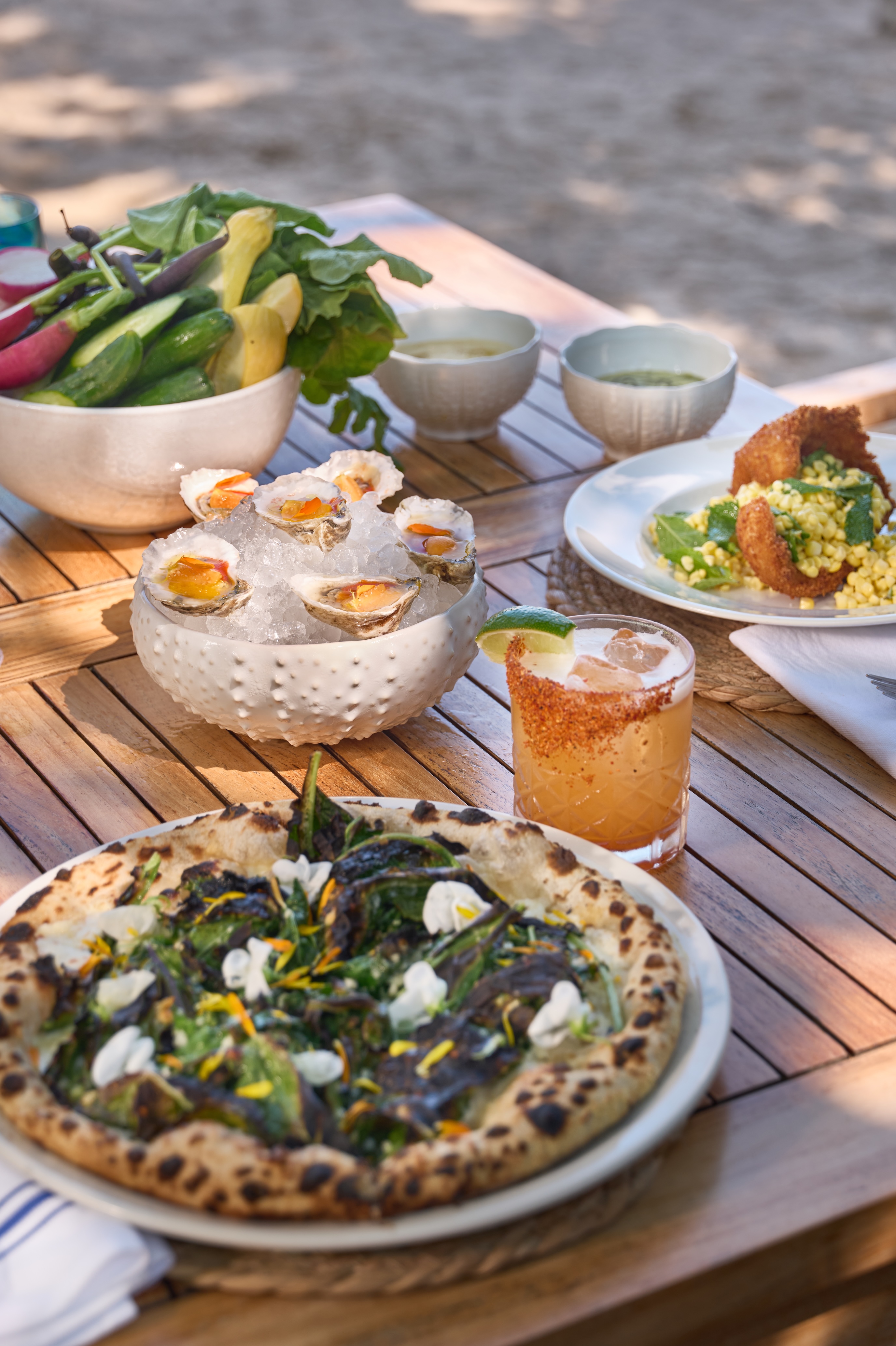 Assorted dinner plates at Eddieu2019s - Assorted dinner plates at Eddieu2019s waterfront restaurant in Greenport on the North Fork of Long Island at Silver Sands Motel, showcasing seasonal coastal dining with harbor views.