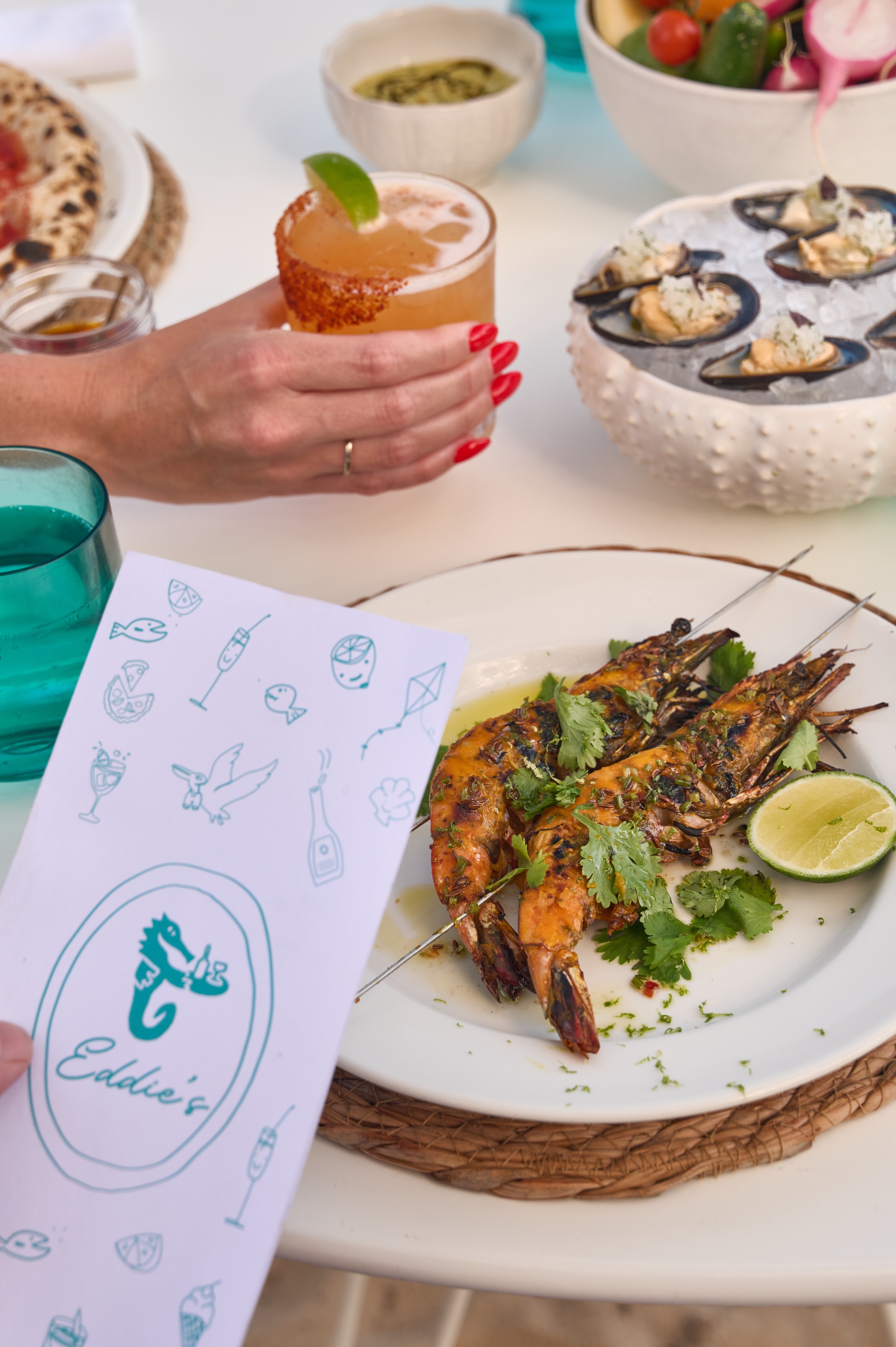 Head-on Prawn Skewers at Eddie's in Greenport - Head-on Prawn Skewers at Eddieu2019s waterfront restaurant in Greenport on the North Fork of Long Island at Silver Sands Motel, highlighting coastal seafood dining with harbor views.