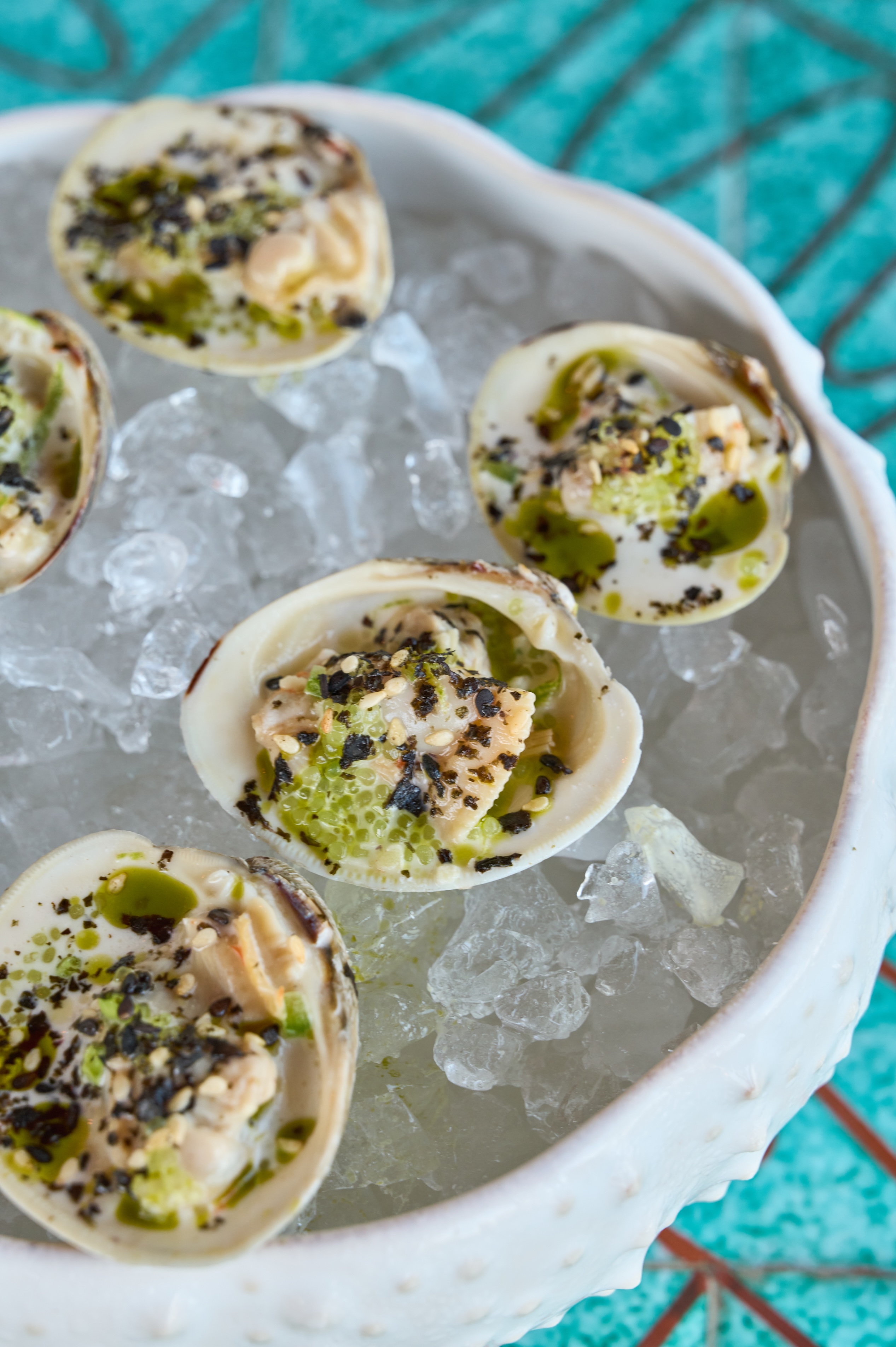 Local Clams at Eddie's in Greenport - Local clams at Eddieu2019s waterfront restaurant in Greenport on the North Fork of Long Island at Silver Sands Motel, showcasing fresh coastal seafood dining with harbor views.
