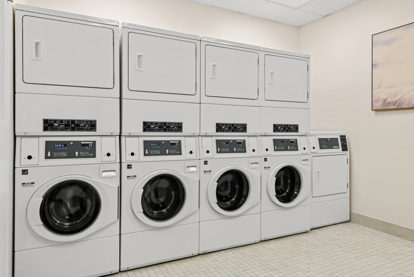 Laundry - Our bright and convenient laundry room features modern, high efficiency washers and dryers for guest use. Designed for comfort and ease, the space allows you to refresh your wardrobe while traveling - with the added benefit of being fully complimentary to use throughout your stay.