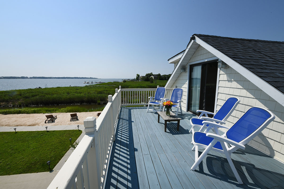 Room Class - Private Balcony (Penthouse) - Featured here is the private balcony within the Penthouse, fitted with four (4) lounge chairs and small tables. Take in the beautiful South facing views  of Tiana Bay all the way to the Atlantic - you truly can see as far as your eyes can see!
