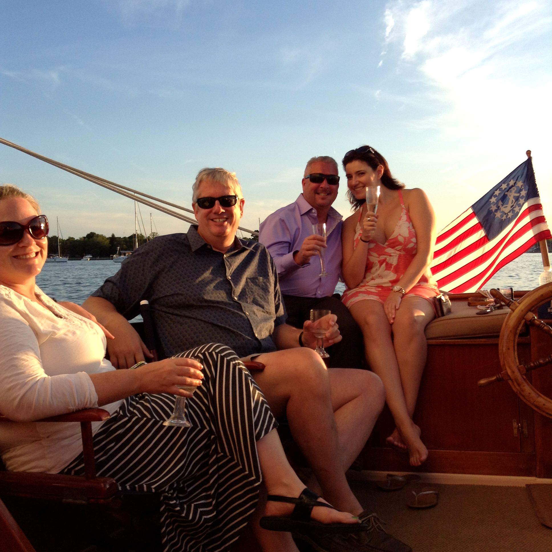 Group of four enjoying champagne on the Selina II