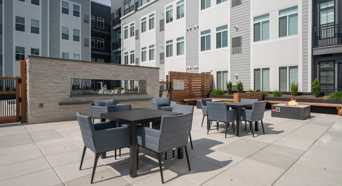Outdoor courtyard at The Core featuring seating, tables, and fire pits