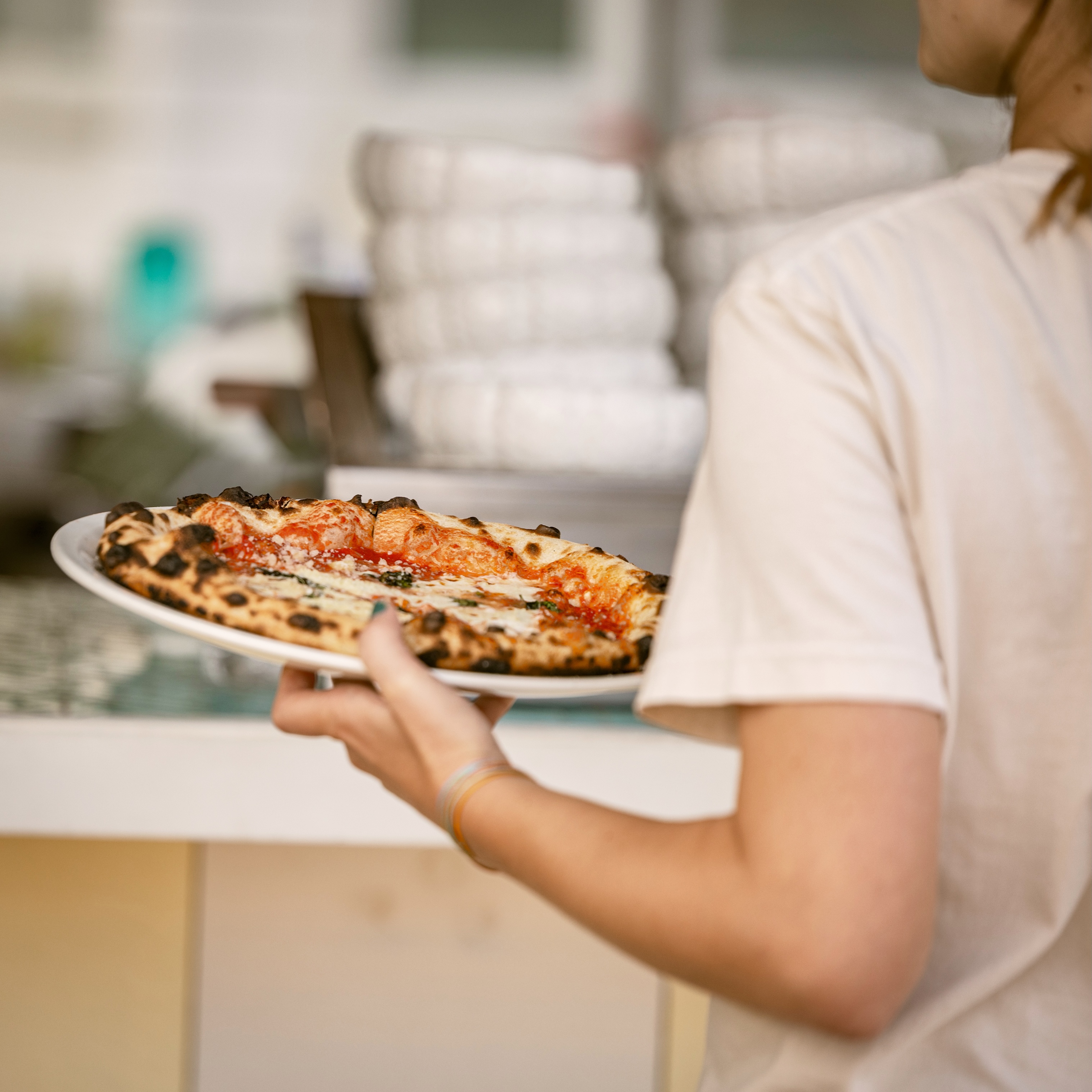 Pizza Eddie's Greenport - Families gathering for dinner at Eddieu2019s waterfront restaurant in Greenport on the North Fork of Long Island at Silver Sands Motel, highlighting group dining and a relaxed coastal atmosphere.