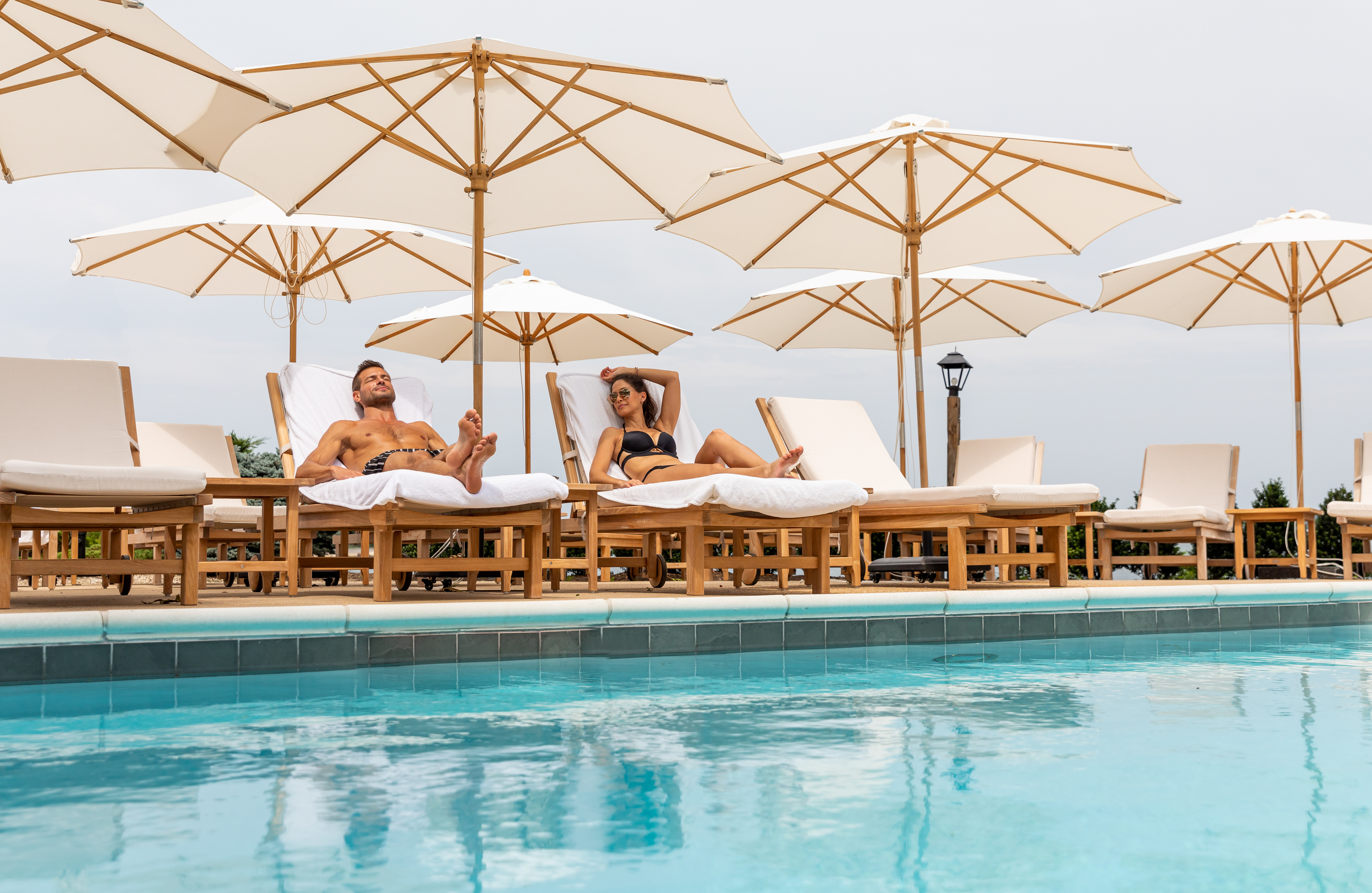 The pool at The Pridwin - Couple relaxing by the pool.