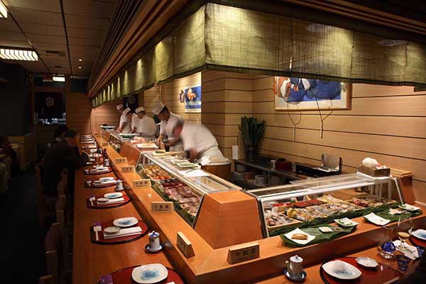 Classic sushi bar interior at Hatsuhana, a historic Japanese restaurant in New York, renowned for authentic Edomae-style sushi since 1976.