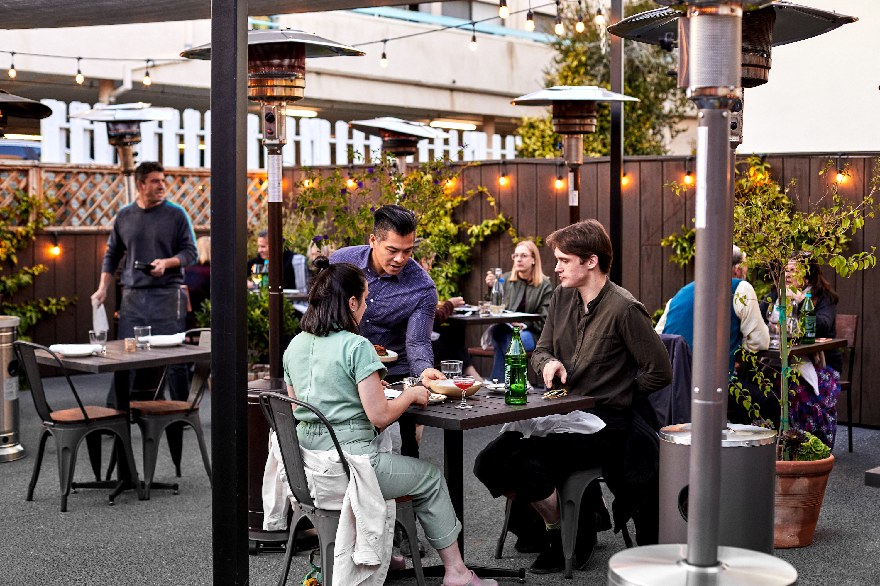 Guests dining on back patio