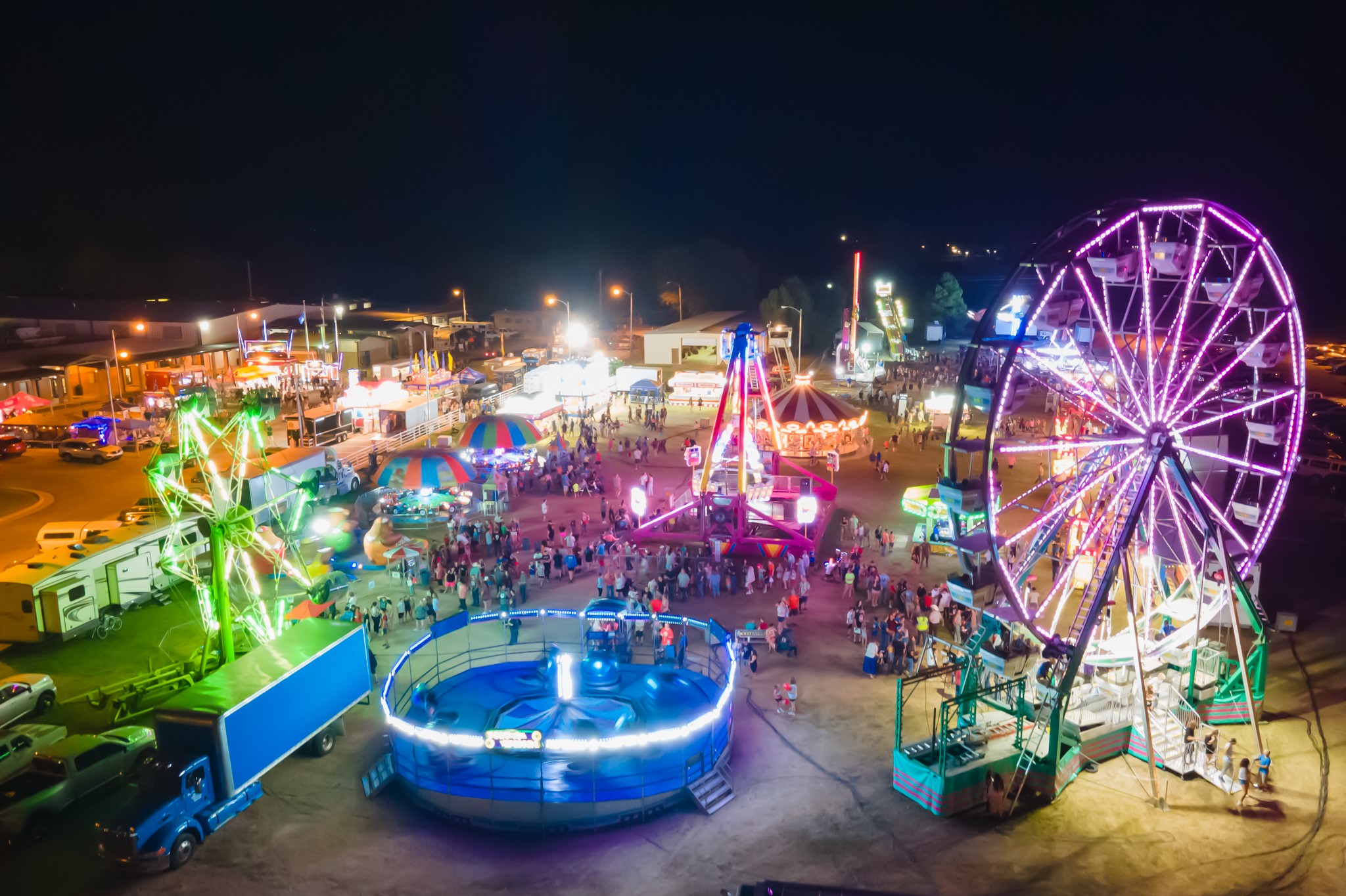 Carnival rides glowing at the Payne County Free Fair in Stillwater