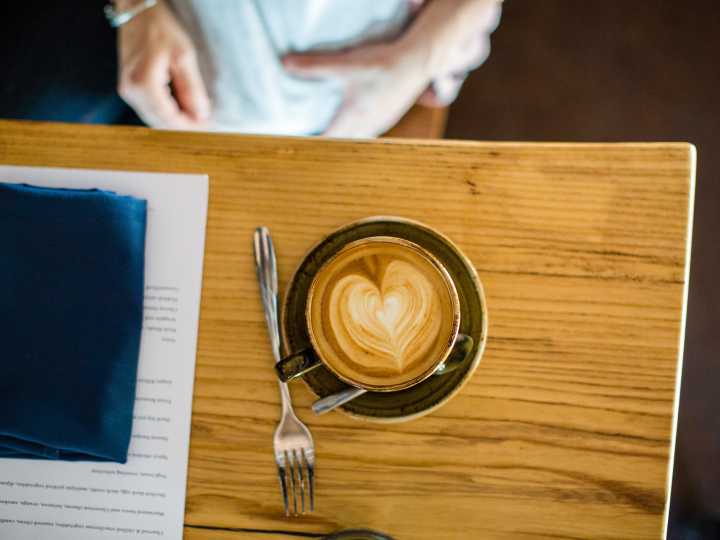 Cup of coffee with a heart design from Stauf's Coffee