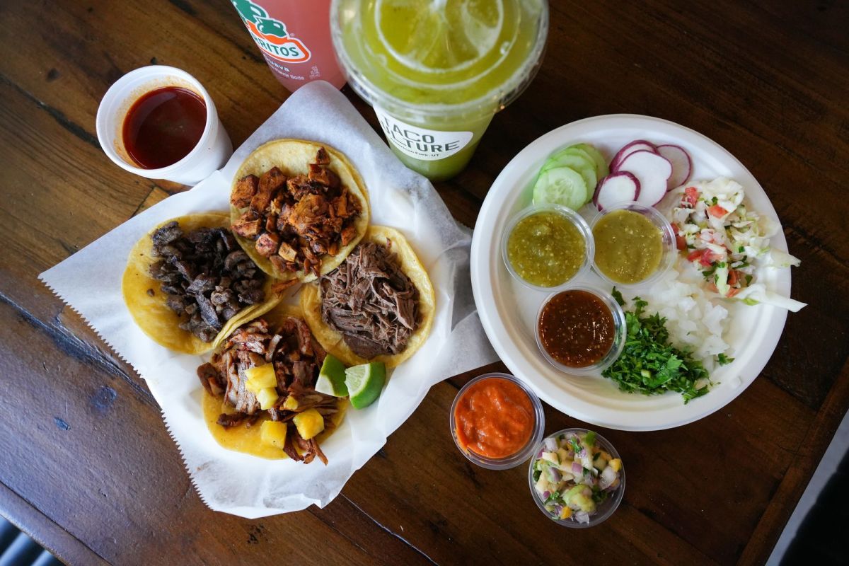 Four tacos served with a spread of salsas, toppings and an agua fresca at Taco Culture in American Fork