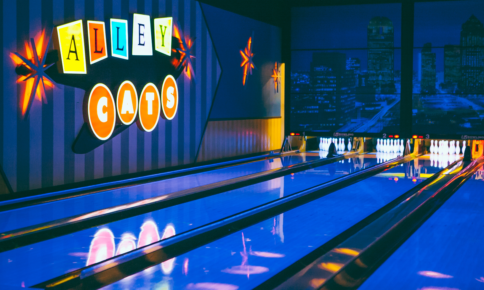 Photo of Alley Cats Entertainment bowling lanes and sign with black light