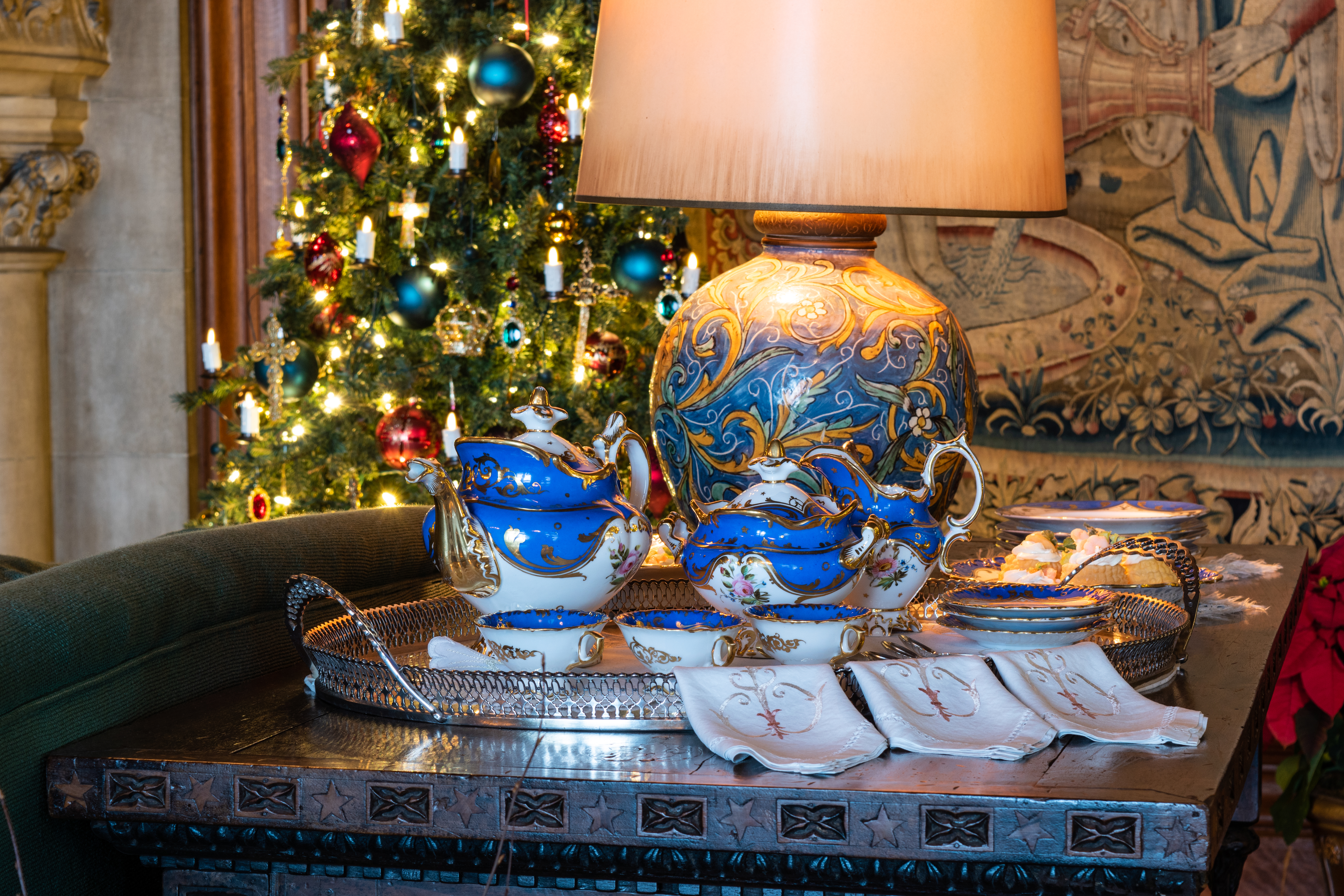 A tea set sits in the Tapestry Gallery during Christmas at Biltmore