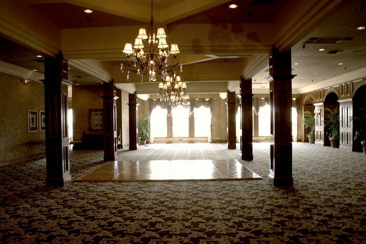 The Neches Room Main Room With Pillars and Chandeliers