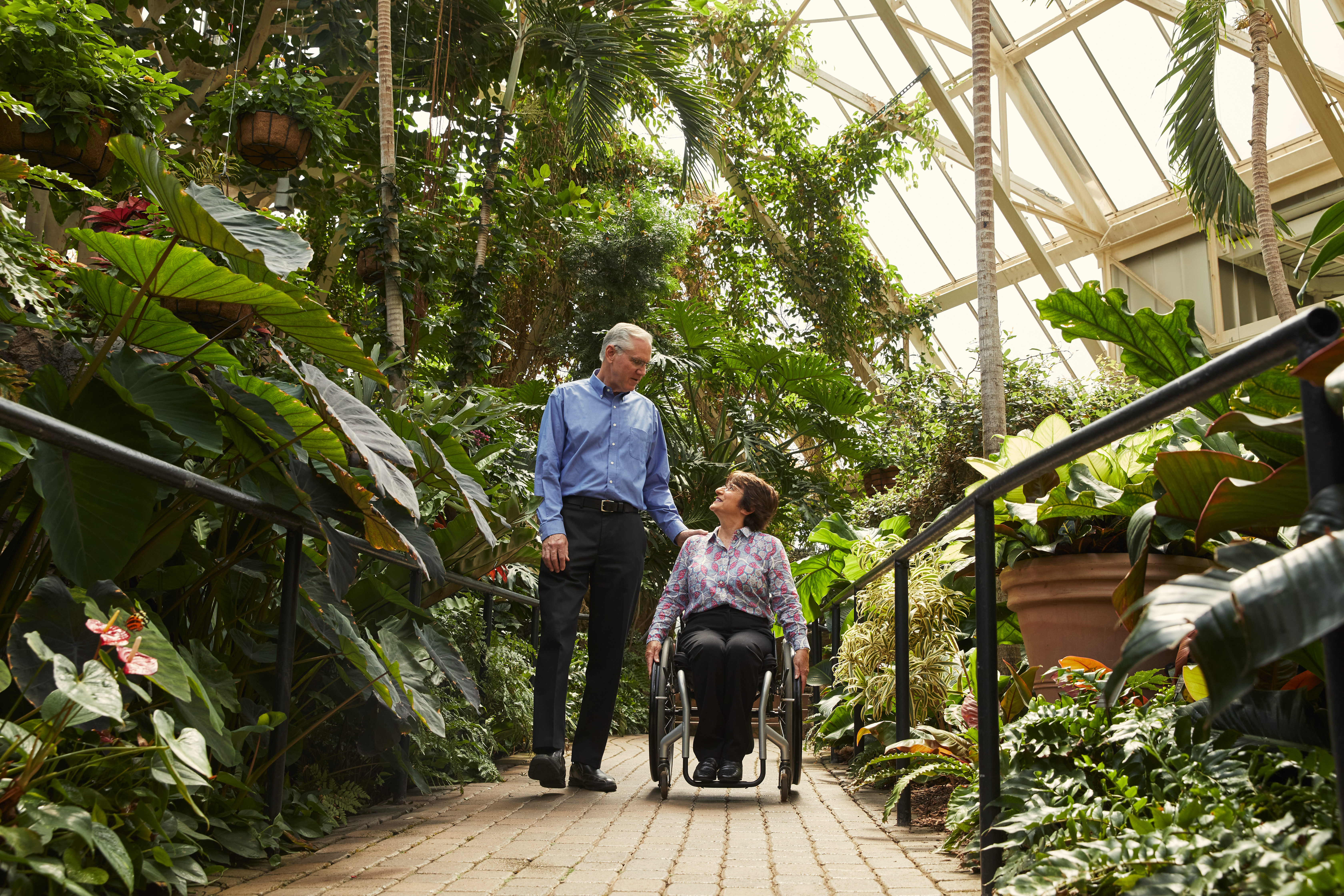 Woman in wheelchair and husband exploring Franklin Park Conservatory