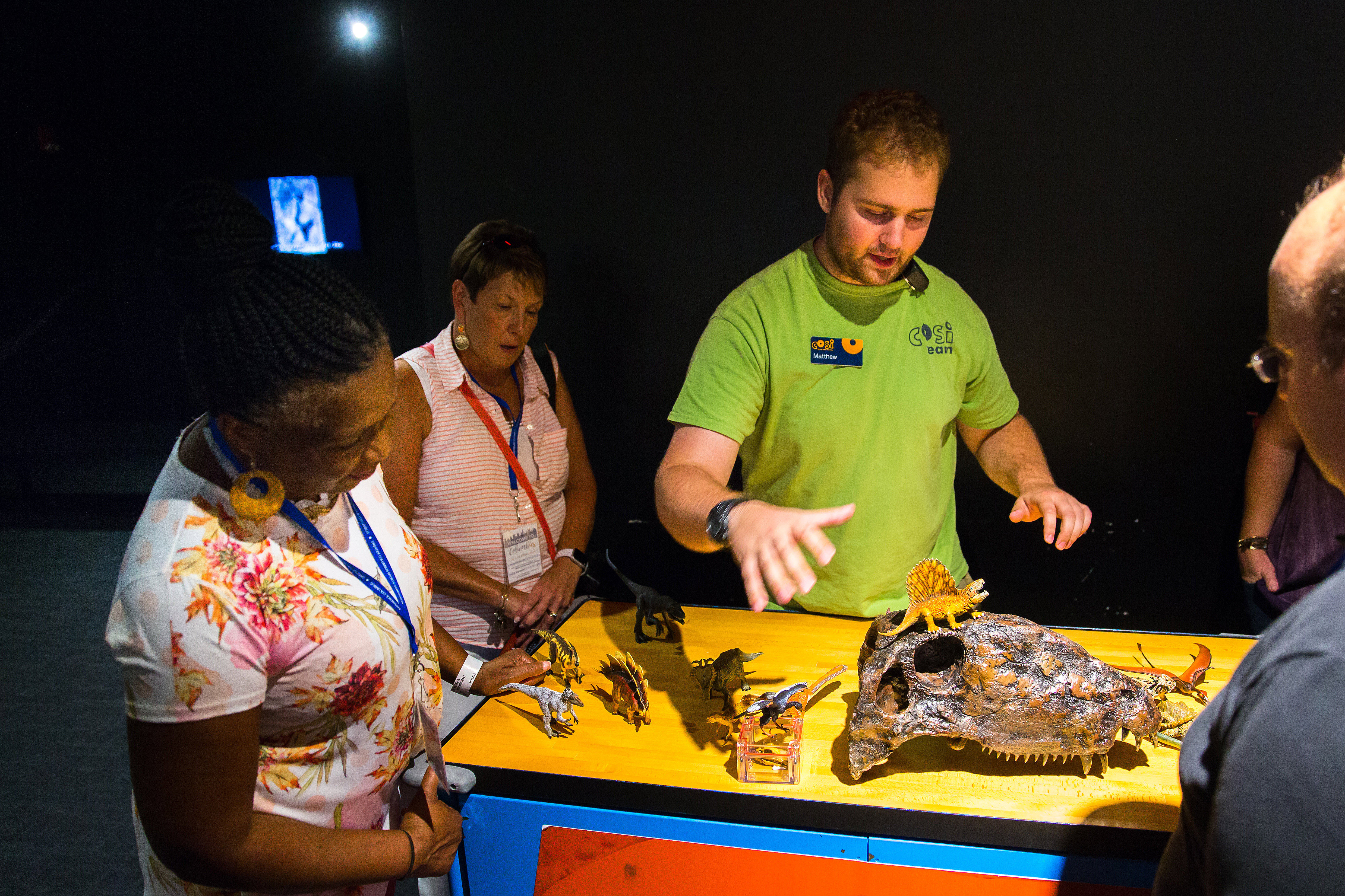 Visitors at dinosaur exhibit in COSI