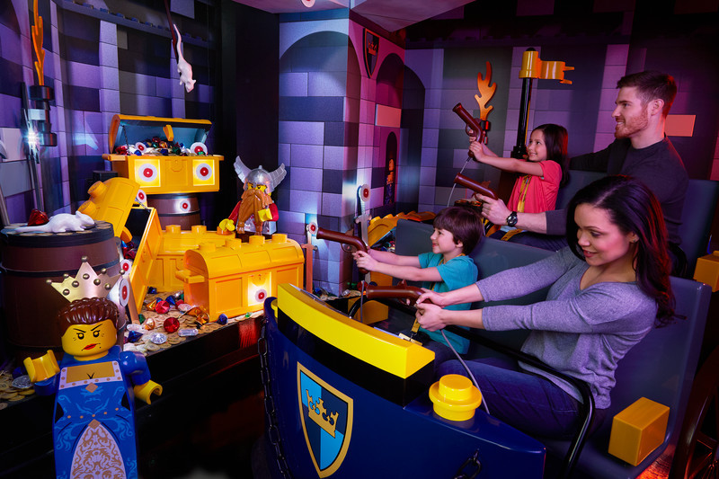 Family playing on Kingdom Quest ride