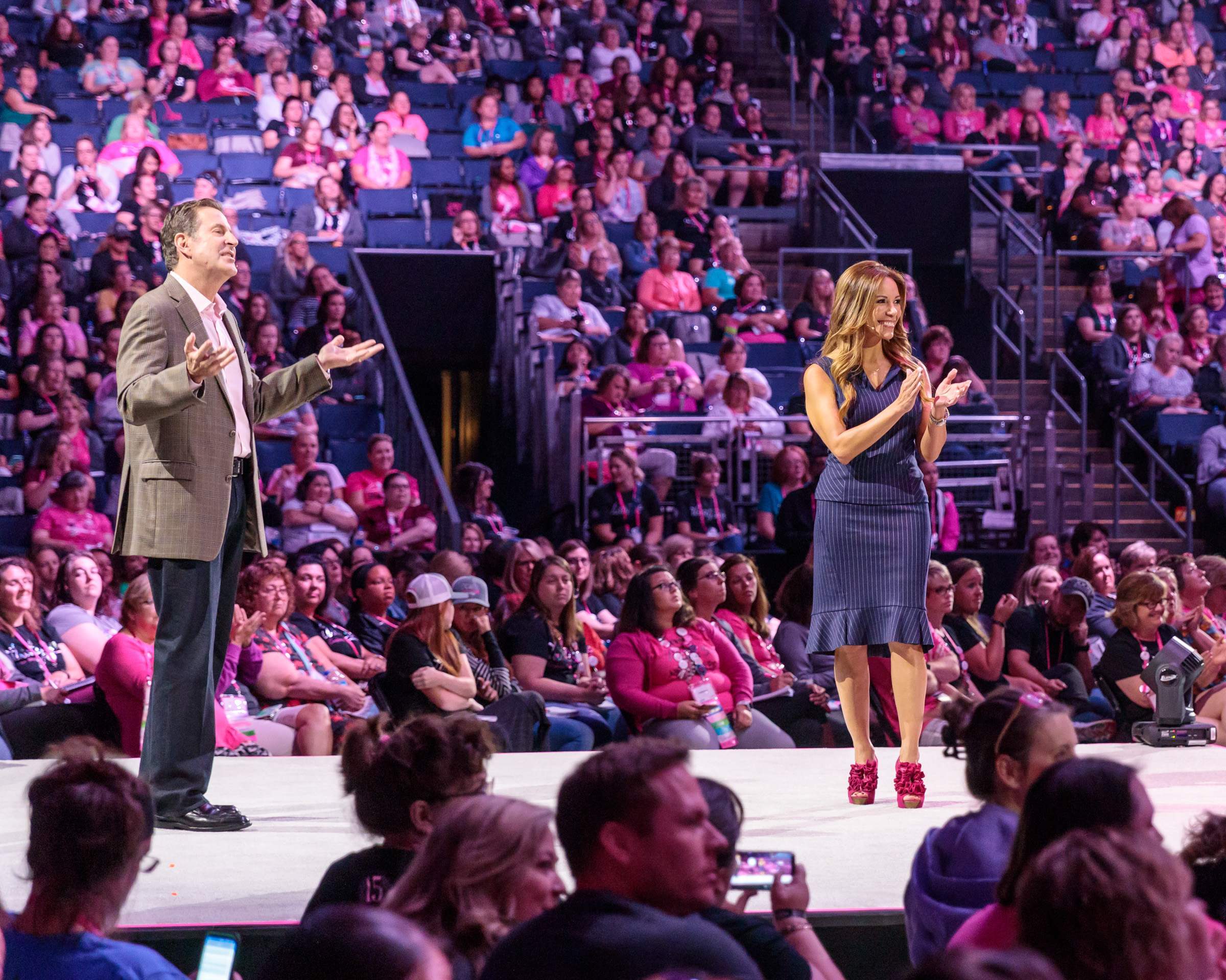 Two speakers on stage during Thirty One Gifts conference in Columbus
