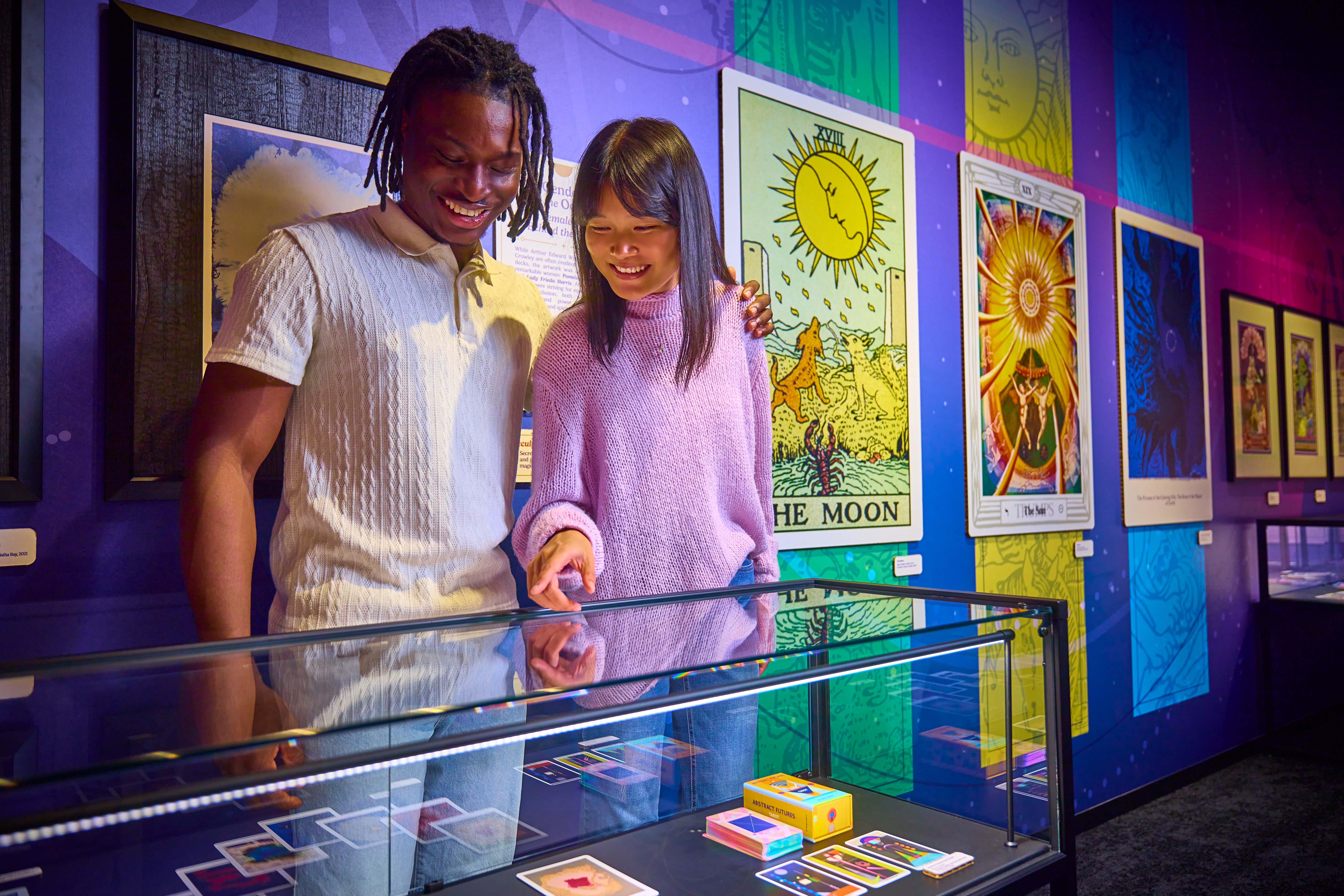 Couple looks at Tarot exhibit in Prototype museum