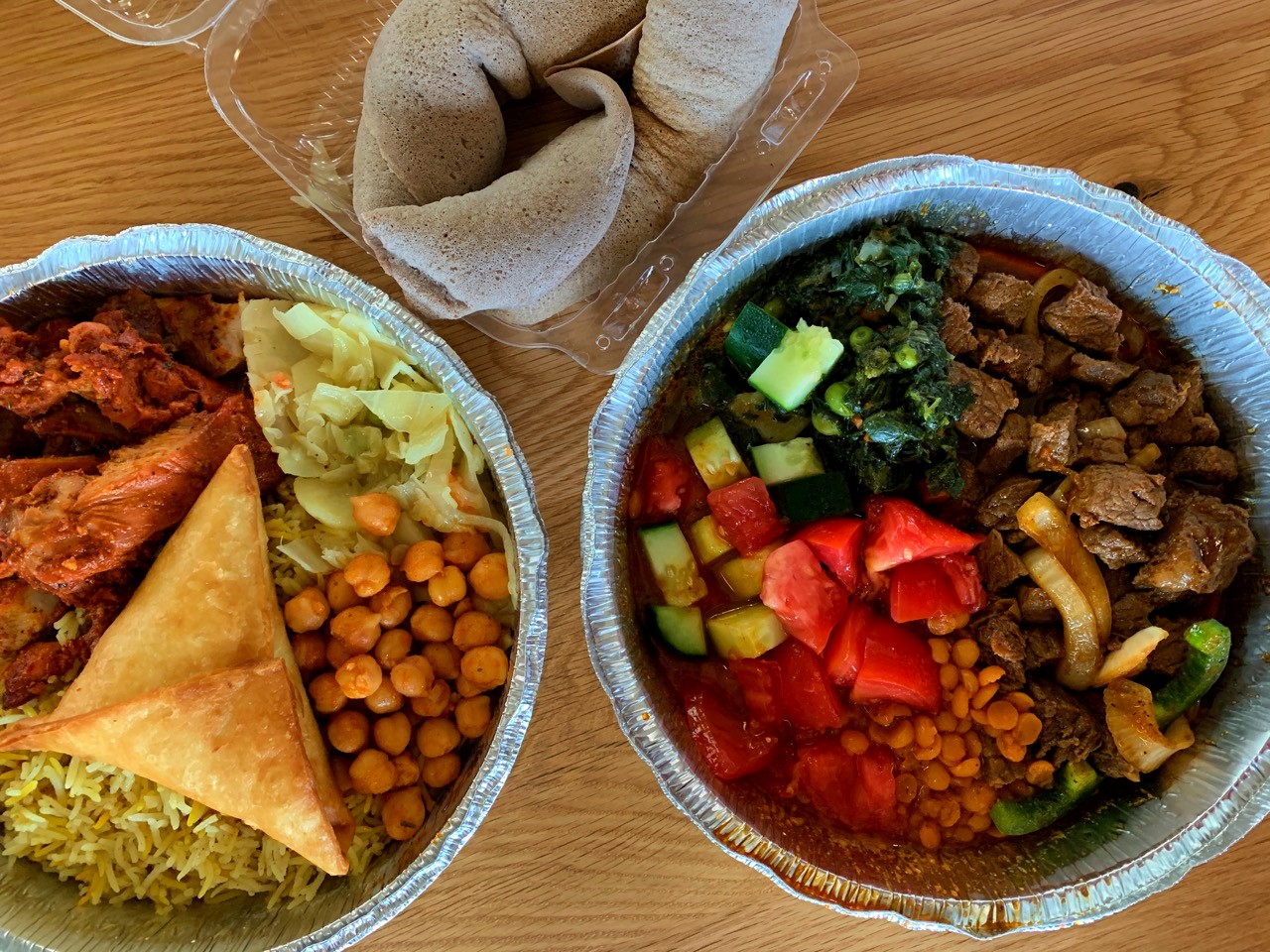 View of food bowls from Hoyo's Kitchen Somali restaurant in North Market