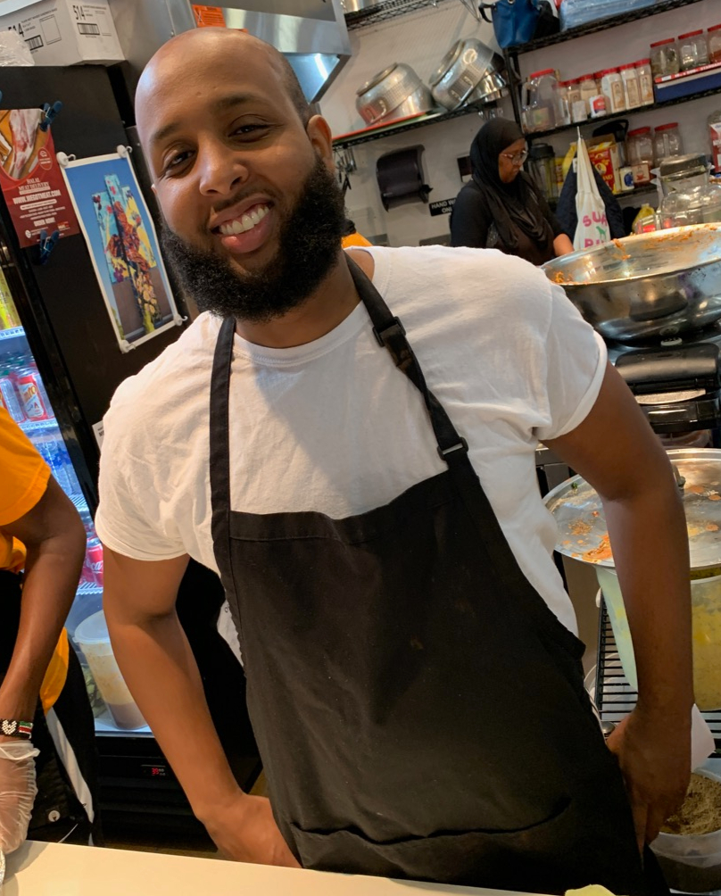 Chef and owner of Hoyo's Kitchen behind restaurant counter