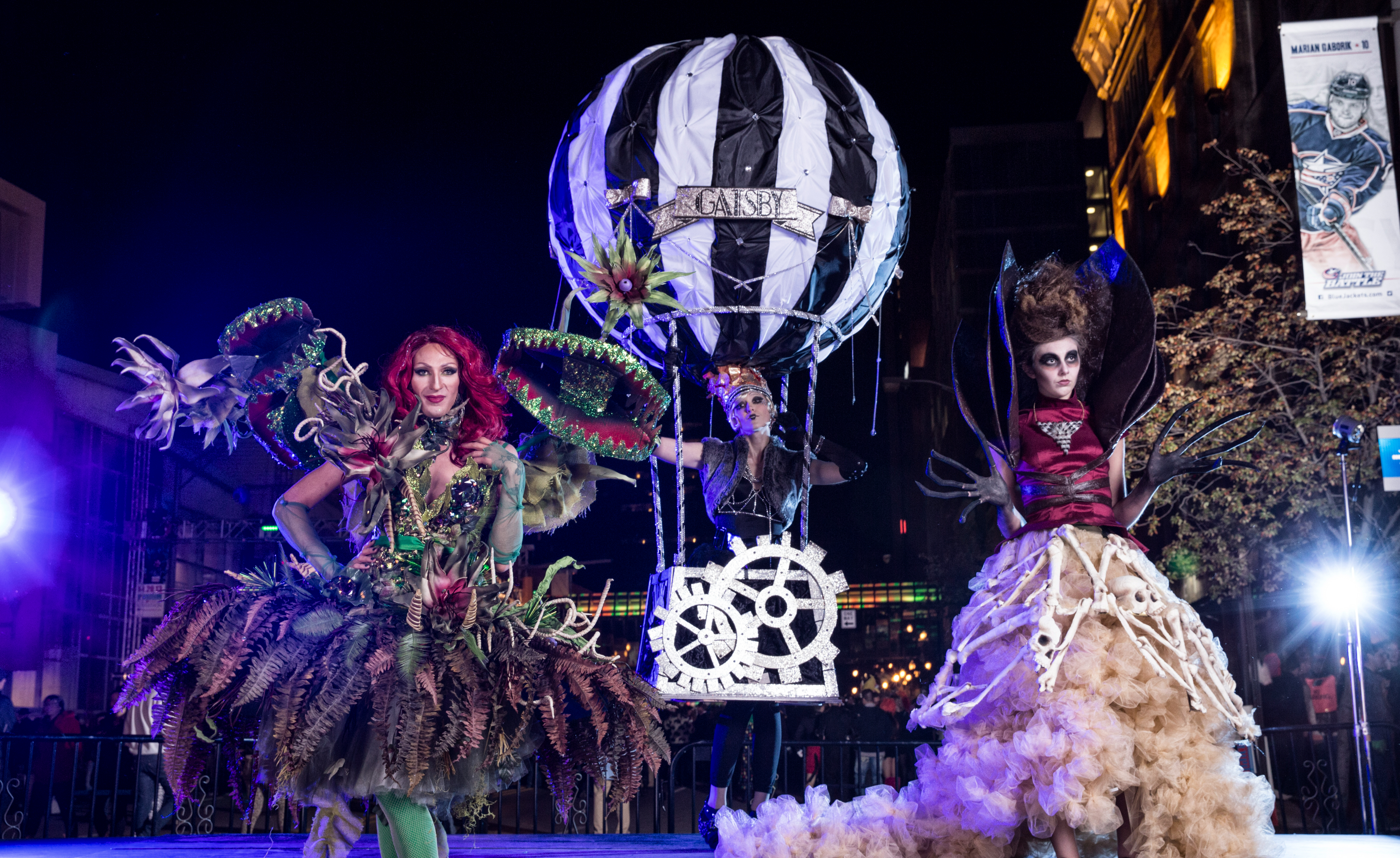 Three women in extravagent costumes at Highball Halloween