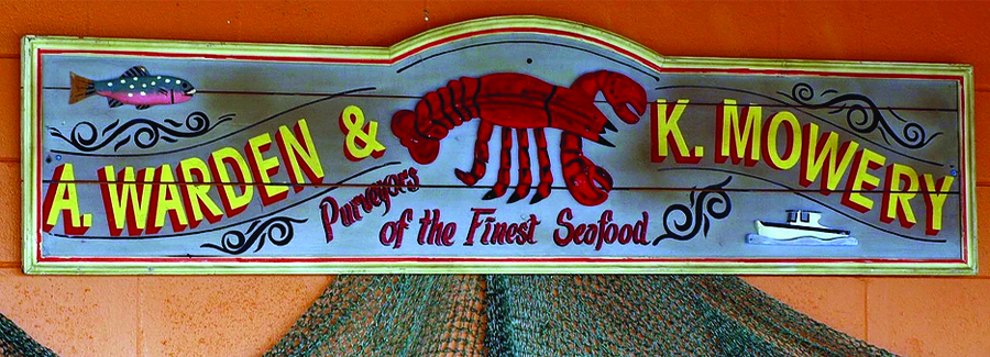 A retro sign indicates purveyors of the finest seafood at Our Deck Down Under