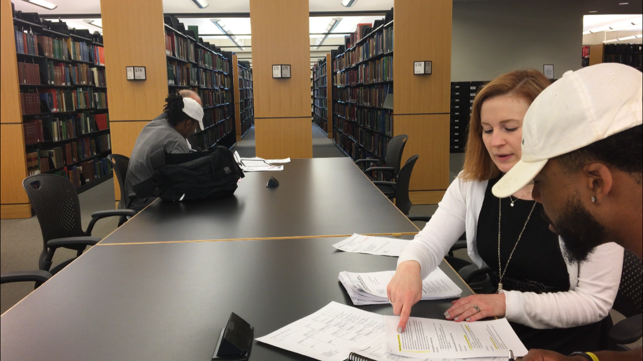 Sampson Levingston researching his family history with Genealogist, Allison Singleton, at the Genealogy Center in Fort Wayne, Indiana